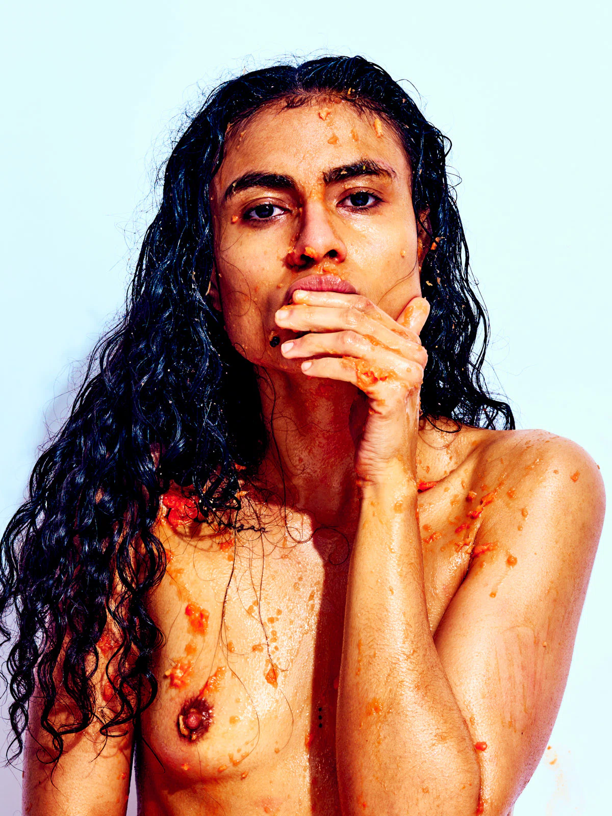 Bold erotic fine art portrait emphasizing playful texture, vibrant color, and confident posture