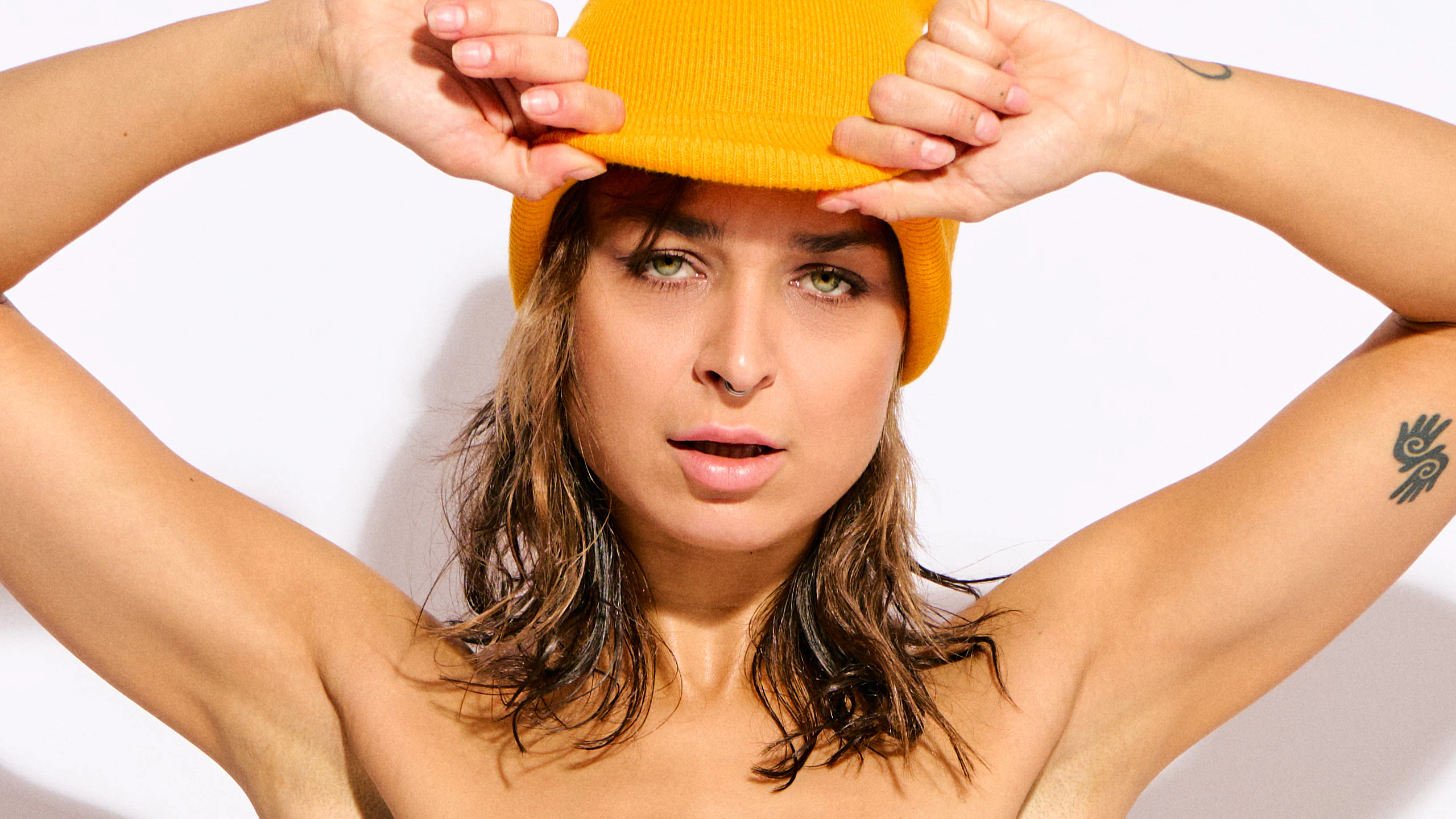 Nude art portrait of Reb Chi emphasizing long legs and confident posing.