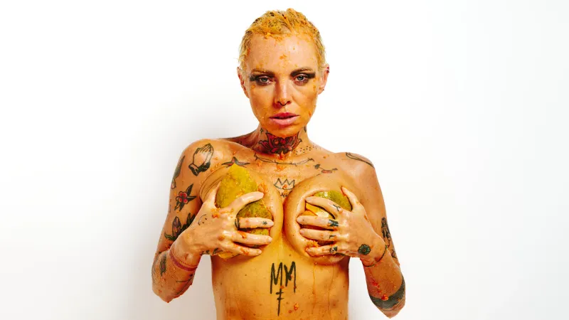 Erotic art portrait of Lu Epic nude with papaya fruit on her body and face