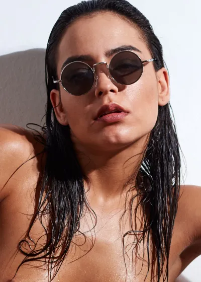 Joy Lamore nude except for net stockings, captured in bold, provocative fine art poses