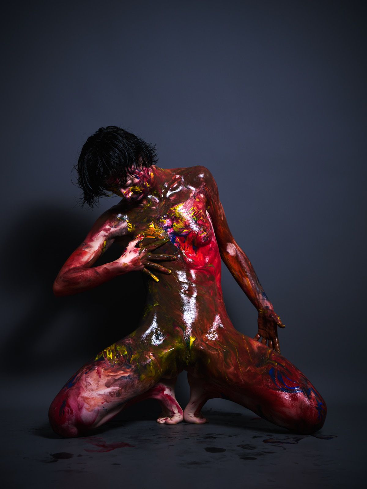 Ulah Bauer German nude model Colored Emotion paint smearing vibrant colors dark backdrop Cinaed Dane studio