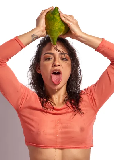 Editorial nude portrait showcasing confidence, expressive gestures, and refined eroticism