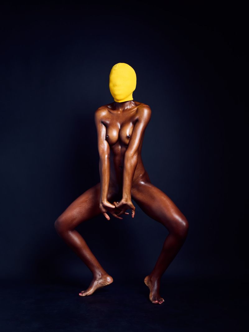 Expressive nude art photograph featuring bold color contrast