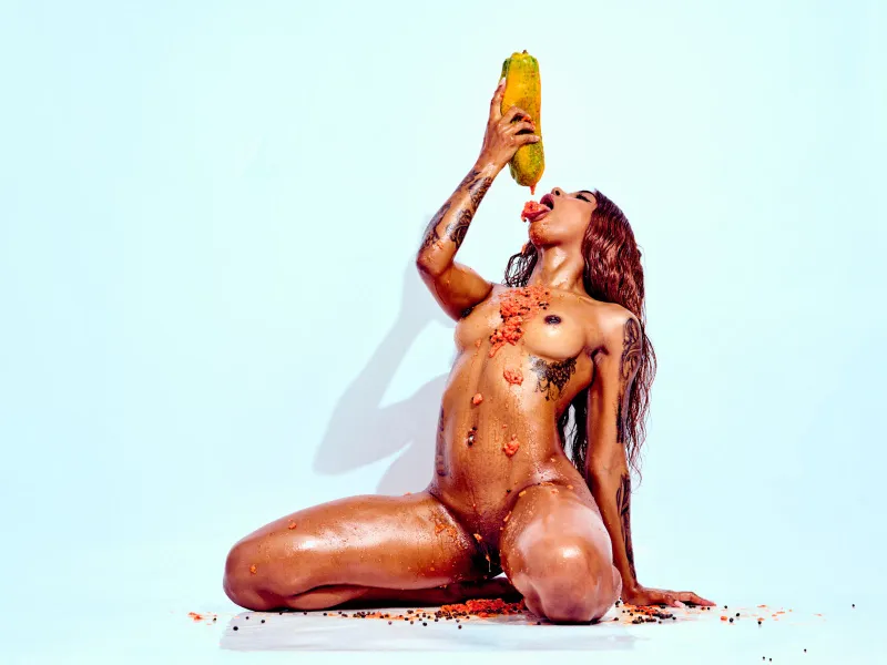 Contemporary nude art featuring African Beauty exploring fruit, texture, and body form.
