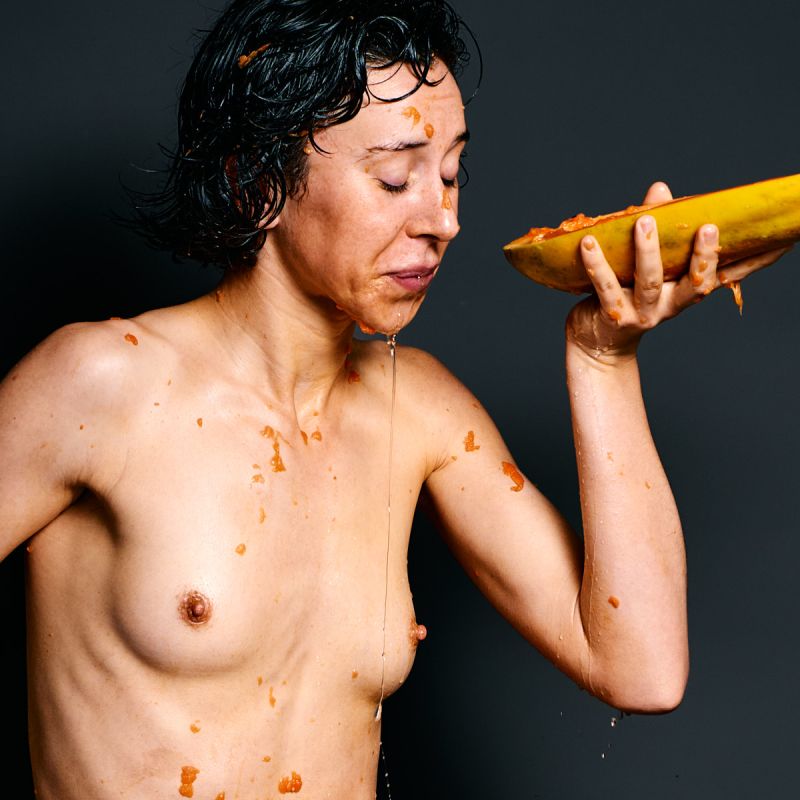 Ulah Bauer German nude model Wet Papaya sensual papaya smearing wet body dark backdrop Cinaed Dane studio