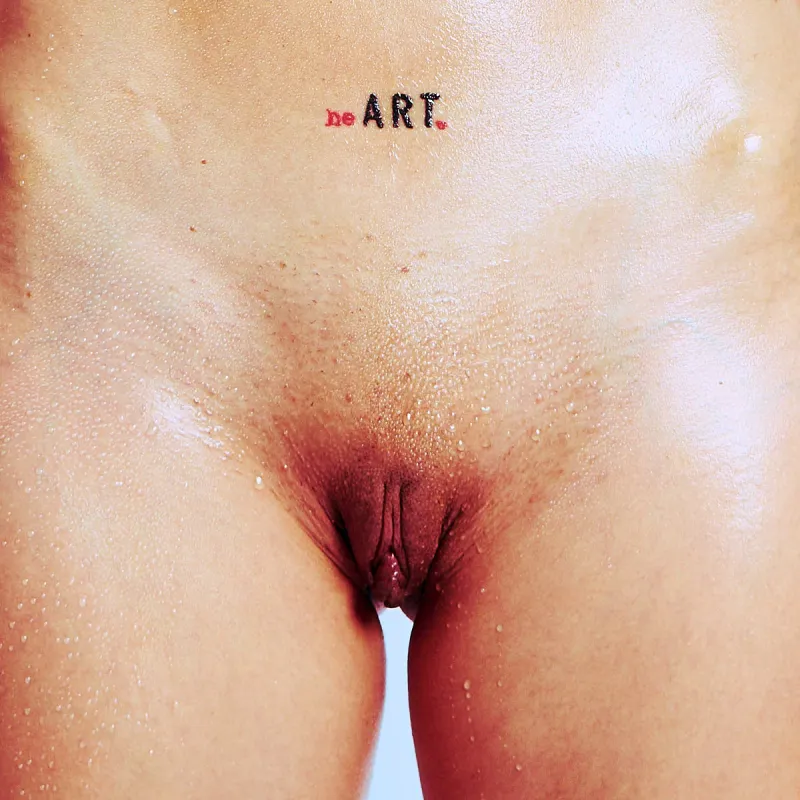 Nude art series of Kiki highlighting tattoos, form, and swimmer-inspired accessories.