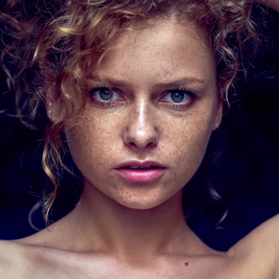 Portrait of Julia Yaroshenko with red hair, expressive face