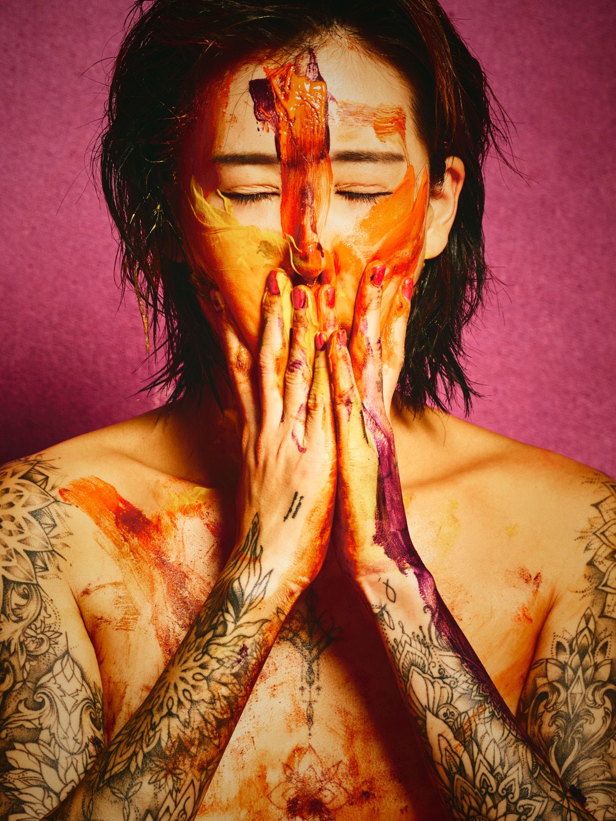 South Korean tattooed model Chloe Painter orange body paint purple fabric backdrop Barcelona photographer Cinaed Dane