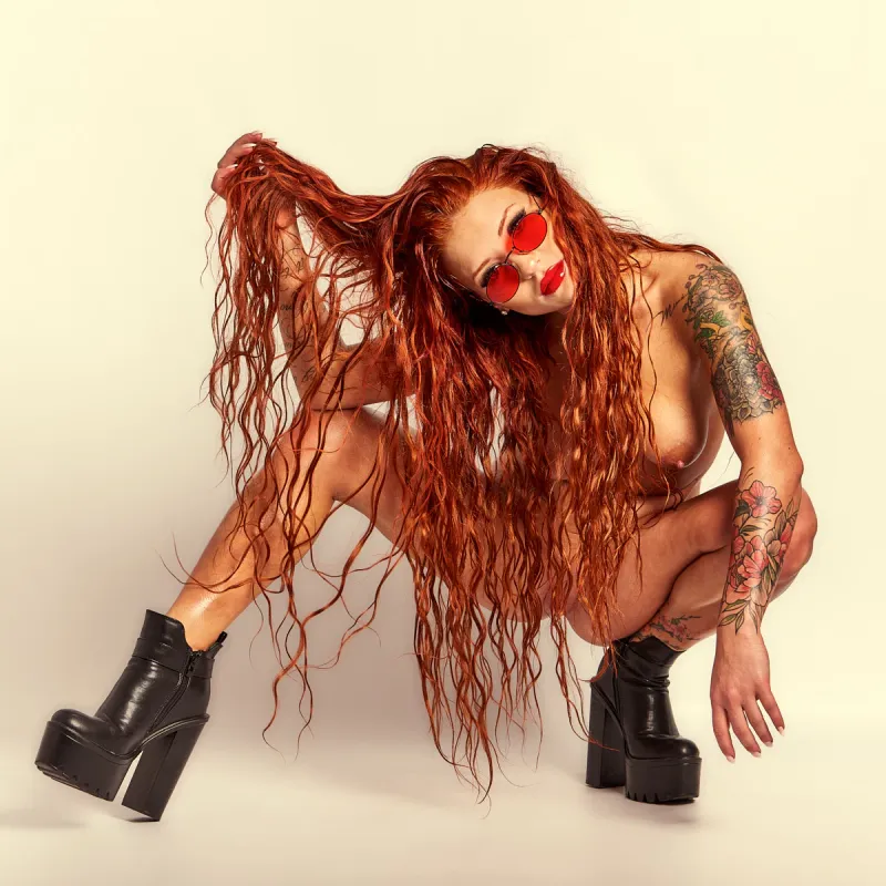 Red Yuliya with long, vibrant red hair in confident, expressive poses from the Red Flame series.