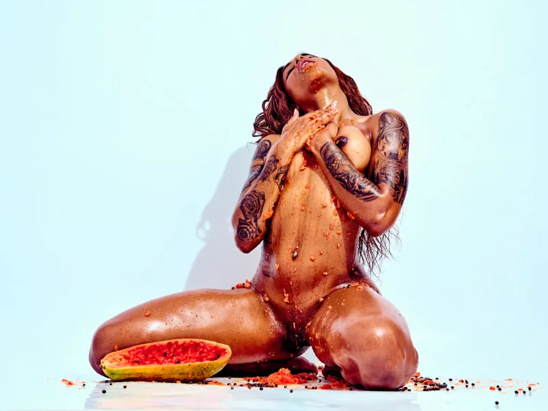 Contemporary nude art featuring African Beauty exploring fruit, texture, and body form.