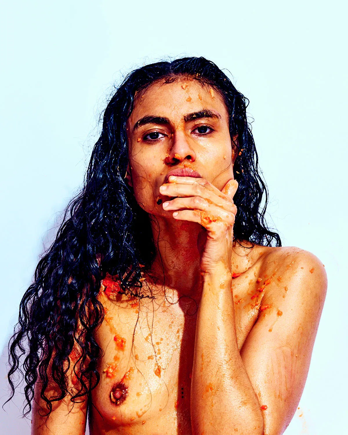 Bold erotic fine art portrait emphasizing playful texture, vibrant color, and confident posture