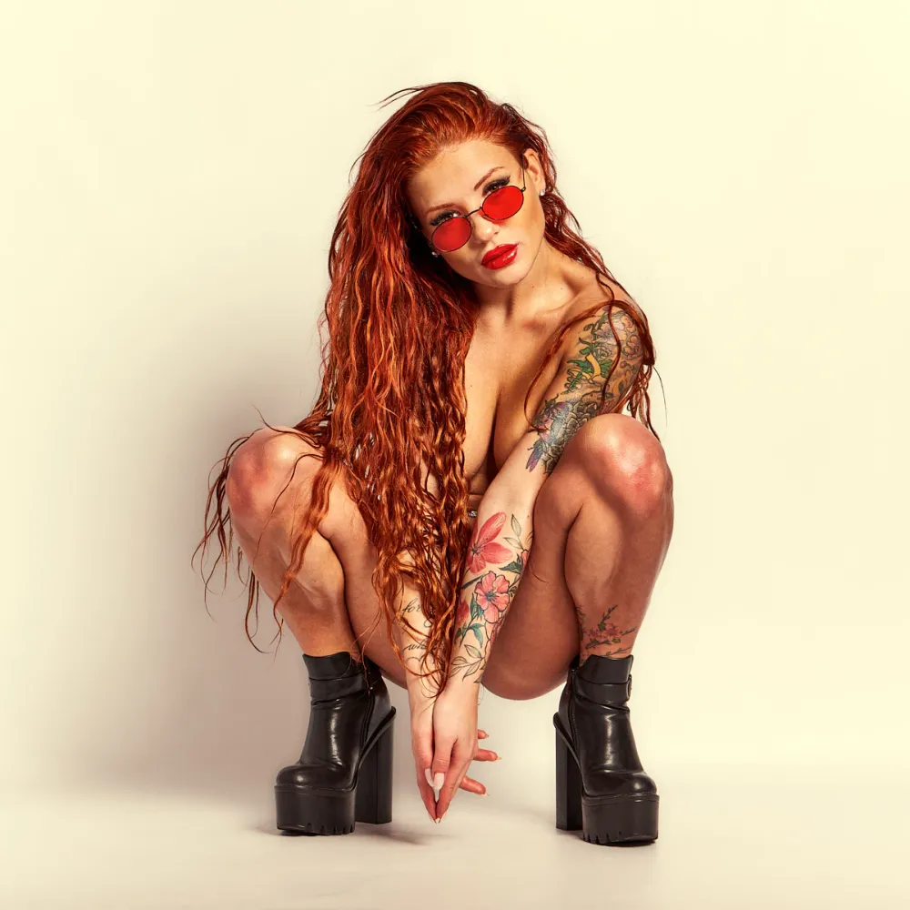 Red Yuliya’s fiery red hair and dynamic poses featured in the Red Flame series, emphasizing her strong presence and expressive style.