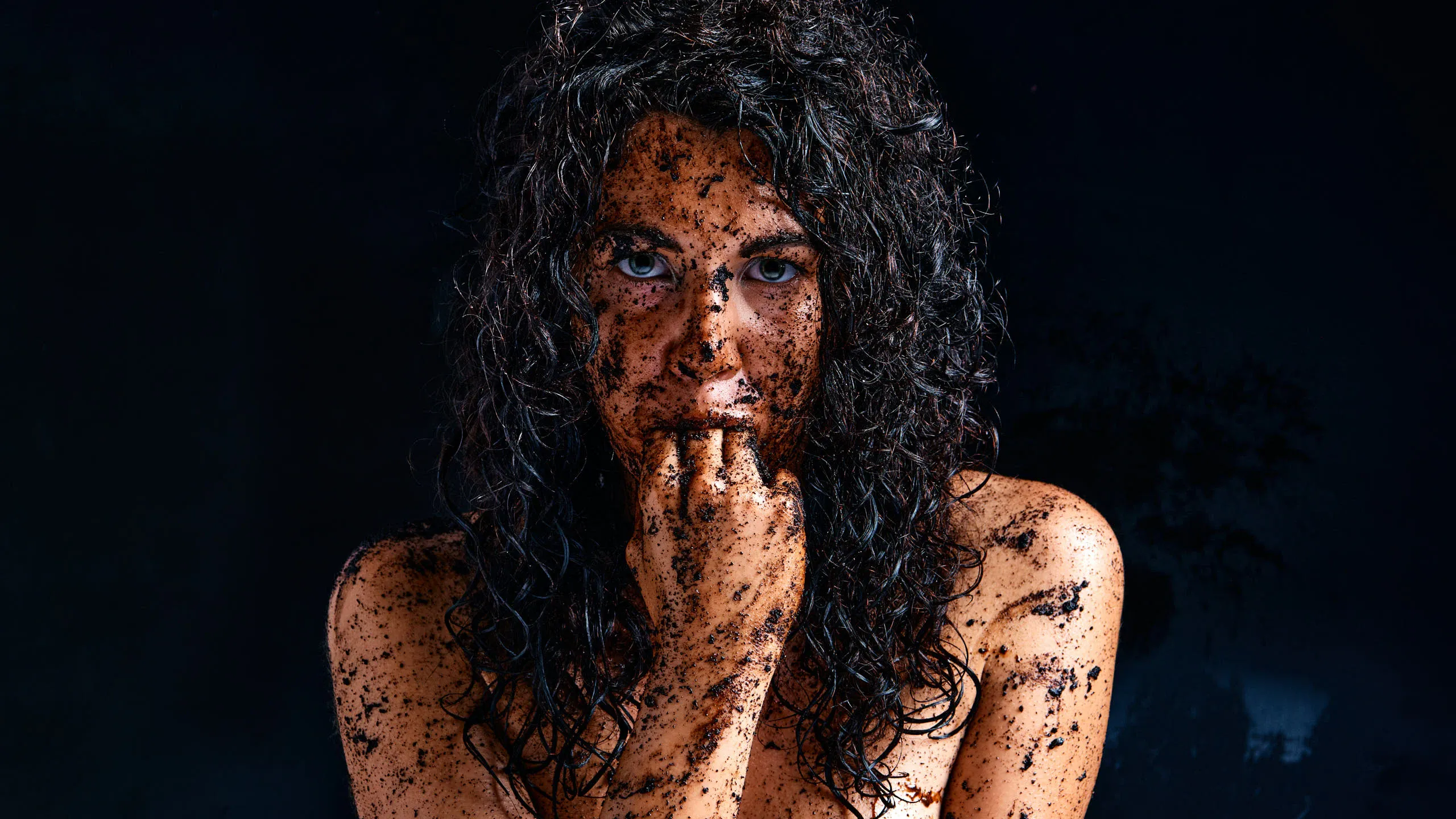 Gia Ren covered in dirt, posing provocatively with a messy, earthy aesthetic in the Dirty series, with fingers in her mouth.